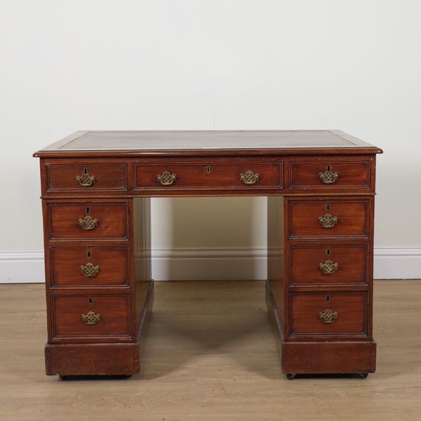 A VICTORIAN MAHOGANY PEDESTAL WRITING DESK