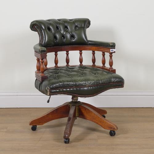 A 20TH CENTURY GREEN LEATHER UPHOLSTERED OFFICE SWIVEL CHAIR