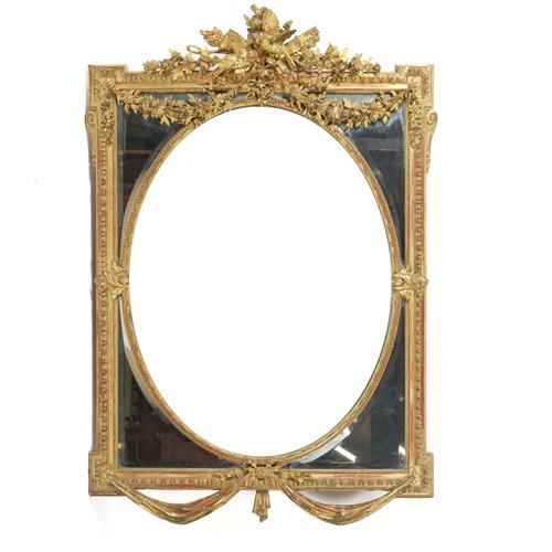 A VICTORIAN GILT FRAMED WALL MIRROR