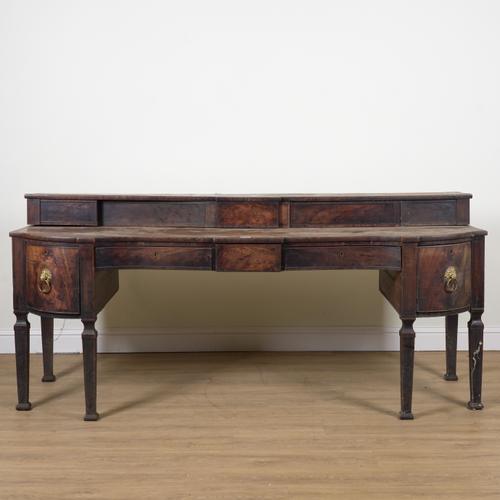 A REGENCY MAHOGANY CONCAVE SIDEBOARD
