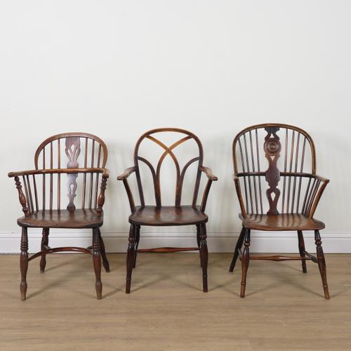 A 19TH CENTURY ASH AND ELM GOTHIC LATTICE BACK WINDSOR CHAIR (3)