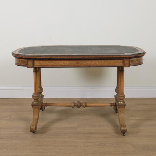 A VICTORIAN GILT METAL MOUNTED FIGURED WALNUT ROUNDED RECTANGULAR CENTRE TABLE