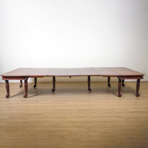 A REGENCY MAHOGANY EXTENDING DINING TABLE