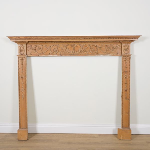 AN 18TH CENTURY STYLE PINE FIRE SURROUND