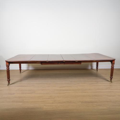 A REGENCY MAHOGANY EXTENDING DINING TABLE