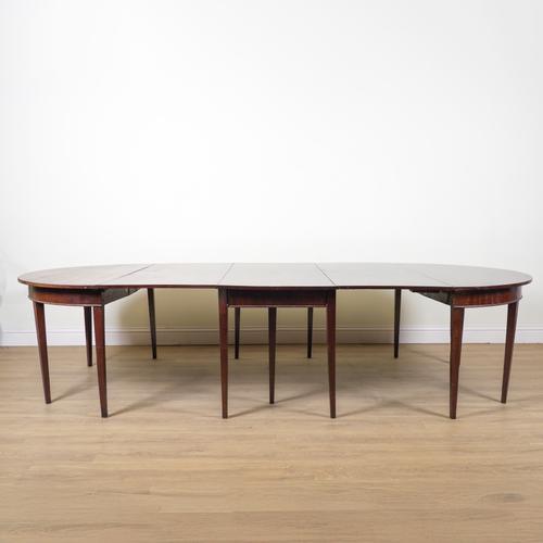 A GEORGE III AND LATER MAHOGANY D-END EXTENDING DINING TABLE