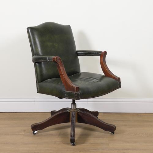A MAHOGANY FRAMED REVOLVING LEATHER DESK CHAIR