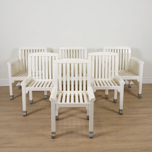 A WHITE PAINTED SLATTED HARDWOOD EIGHT PIECE PATIO SET (8)