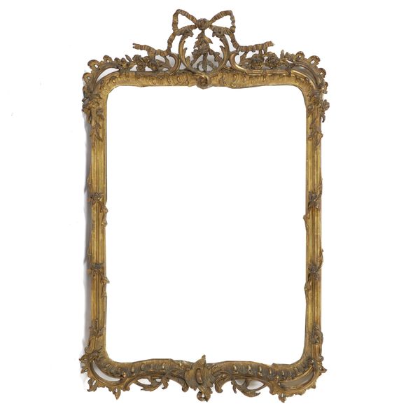 A 19TH CENTURY SHAPED RECTANGULAR GILT FRAMED WALL MIRROR
