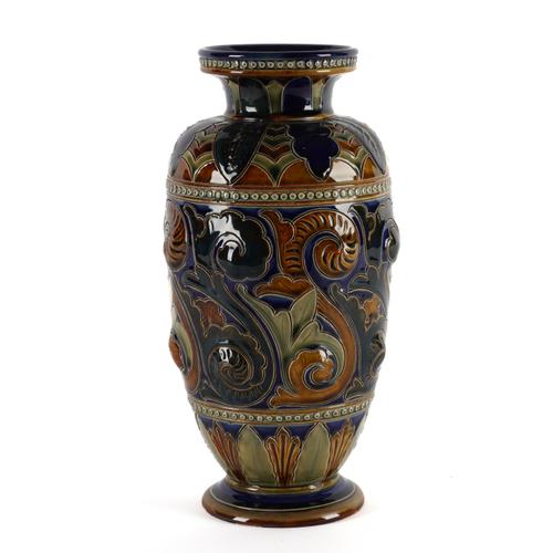 A TALL DOULTON LAMBETH STONEWARE VASE BY FRANK BUTLER