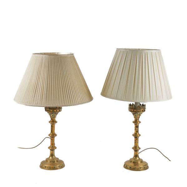 A PAIR OF GOTHIC BRASS ALTAR CANDLESTICKS ADAPTED TO TABLE LAMPS (2)