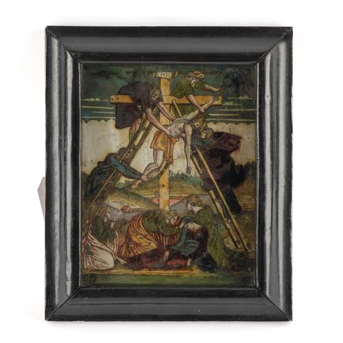 A CONTINENTAL REVERSE GLASS PAINTING DEPICTING THE CHRIST'S DEPOSITION FROM THE CROSS
