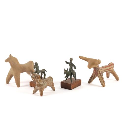 A MYCENAEAN TERRACOTTA FRAGMENTARY STATUETTE OF A BULL AND FOUR OTHER STATUETTES (5)