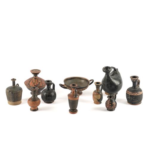 A GROUP OF GREEK SOUTH ITALIAN BLACK TERRACOTTA VESSELS (10)