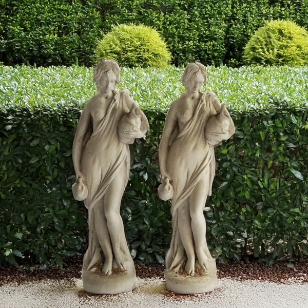 A PAIR OF RECONSTITUTED STONE FIGURES OF FEMALE WATER CARRIERS  (2)