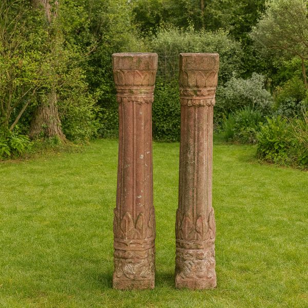 A PAIR OF INDIAN CARVED STONE FLUTED COLUMNS (2)