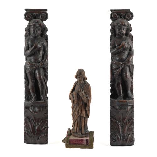 A NORTH EUROPEAN CARVED OAK FIGURE OF A SAINT TOGETHER WITH A PAIR CARVED OAK CARYATID FIGURES (3)