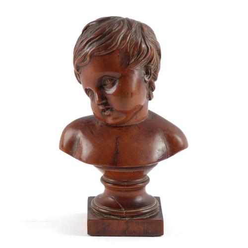 A BOXWOOD CARVED BUST OF A BOY