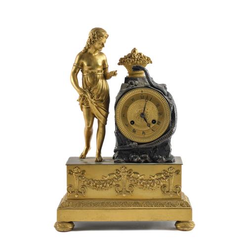 A RESTAURATION GILT AND PATINATED BRONZE MANTEL CLOCK