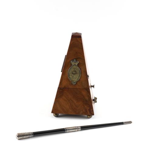 A SILVER-MOUNTED CONDUCTOR’S BATON AND A WALNUT CASED METRONOME (2)