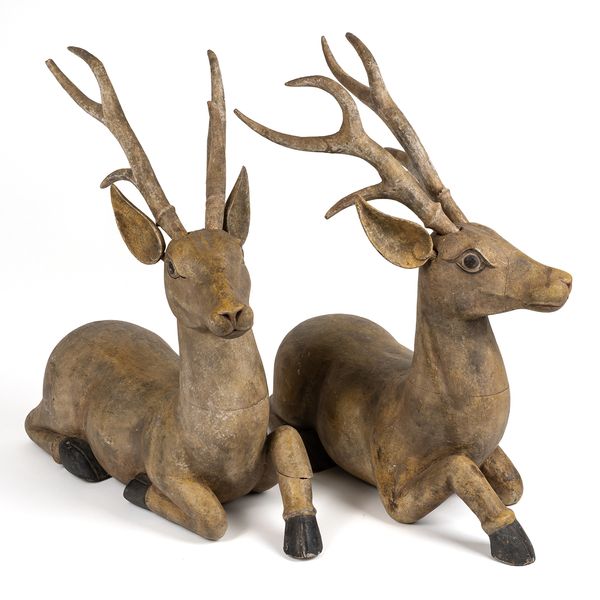A LARGE PAIR OF CHINESE CARVED AND PAINTED MODELS OF DEER ( 10)