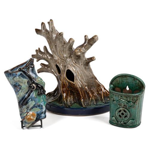 A CHINESE POTTERY FLOWER HOLDER (3)