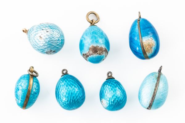 A GROUP SEVEN BLUE ENAMEL EGG CHARMS (7)