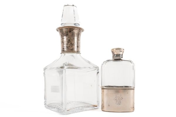 A SILVER MOUNTED GLASS SPIRIT FLASK AND A EUROPEAN SPIRIT DECANTER (2)