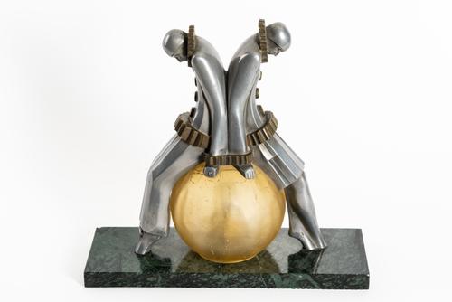 AN ART DECO ALUMINIUM AND BRASS ‘PIERROT’ FIGURAL TABLE LAMP
