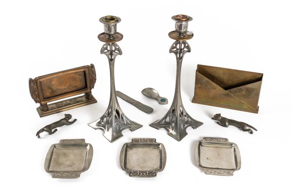 A PAIR OF WMF PEWTER ART NOUVEAU CANDLESTICKS AND THREE TUDRIC PEWTER PIN TRAYS AFTER A DESIGN BY ARCHIBOLD KNOX (11)