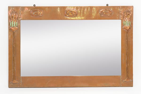 IN THE MANNER OF LIBERTY & CO; AN ARTS & CRAFTS COPPER FRAMED RECTANGULAR WALL MIRROR