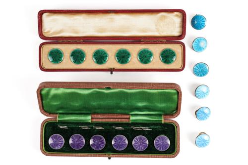 THREE SETS OF SIX SILVER GILT AND ENAMELLED BUTTONS (18)