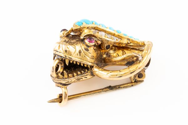 A VICTORIAN GEMSET SNAKE HEAD BROOCH