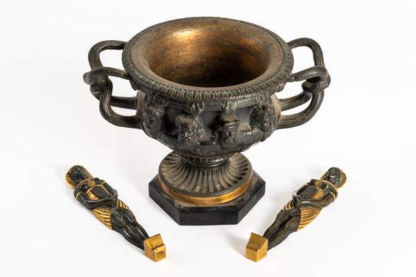 AFTER THE ANTIQUE: A PATINATED BRONZE AND GILT METAL WARWICK VASE AND TWO EGYPTIAN PHARAOH CARYATID MOUNTS (3)