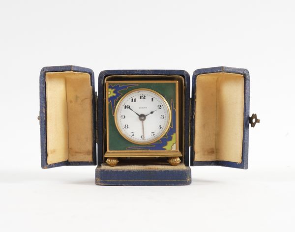 ZENITH: A CHAMPLEVÉ ENAMEL AND BRASS TRAVELLING ALARM CLOCK, CASED