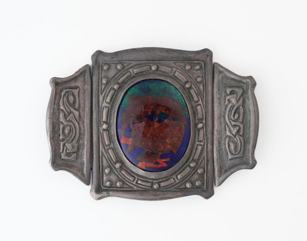 A SILVER AND ENAMELLED WAISTBELT BUCKLE