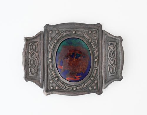 A SILVER AND ENAMELLED WAISTBELT BUCKLE