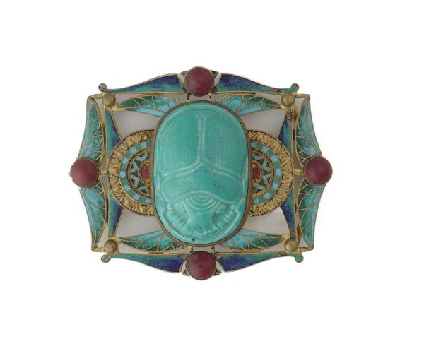 PIEL FRERES; A GILT METAL ENAMELLED AND CERAMIC WAISTBELT BUCKLE