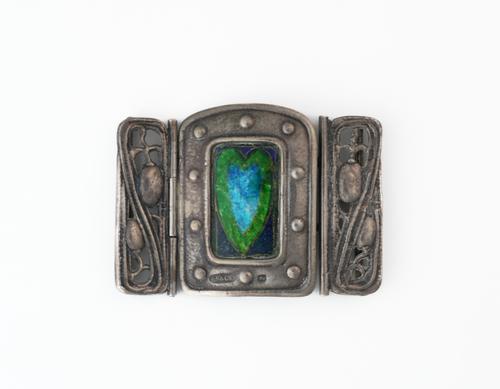 A RAMSDEN AND CARR SILVER AND ENAMELLED WAISTBELT BUCKLE