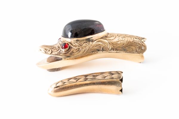 A VICTORIAN GARNET SNAKE HEAD AND TAIL