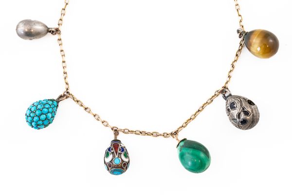 AN EARLY 20TH CENTURY EGG CHARM NECKLACE