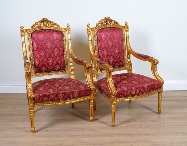 A PAIR OF LOUIS XVI STYLE GILT FRAMED OPEN ARMCHAIRS