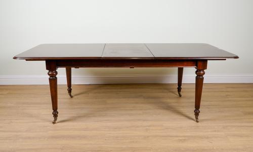 A VICTORIAN STYLE MAHOGANY EXTENDING DINING TABLE