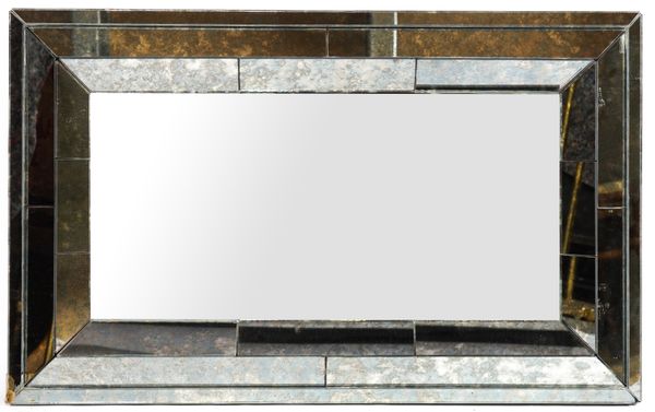 A SET OF FOUR MODERN CUSHION FRAMED MARGINAL WALL MIRRORS (4)