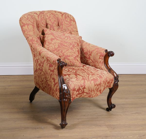 A VICTORIAN CARVED ROSEWOOD FRAMED TUB BACK EASY ARMCHAIR