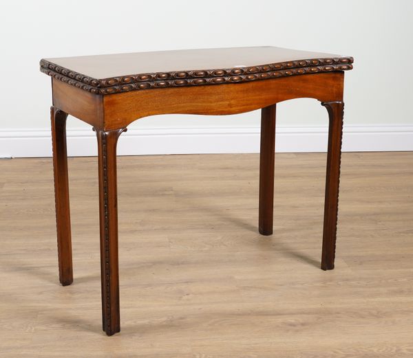 A GEORGE III MAHOGANY SERPENTINE CARD TABLE