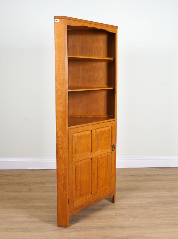 HEALS; A MODERN OAK FLOORSTANDING CORNER CUPBOARD