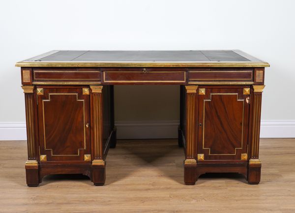 A LOUIS XVI STYLE GILT METAL MOUNTED WALNUT PEDESTAL DESK