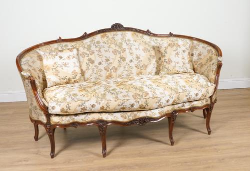A MID 18TH CENTURY FRENCH CARVED WALNUT FRAMED TUB BACK SOFA