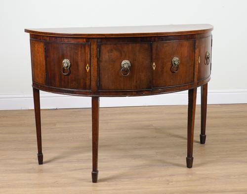 A GEORGE III MAHOGANY DEMI-LUNE SIDEBOARD